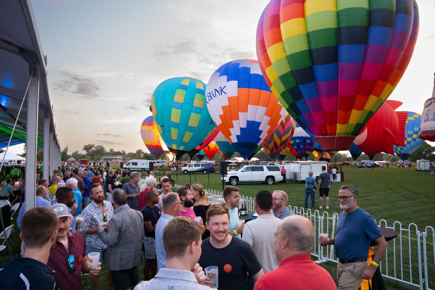Guests mingle during the Balloon Glow in Forest Park.